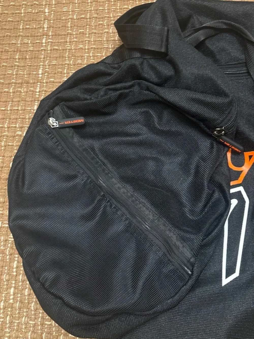 Meister Black Duffel Bag with Orange Accent